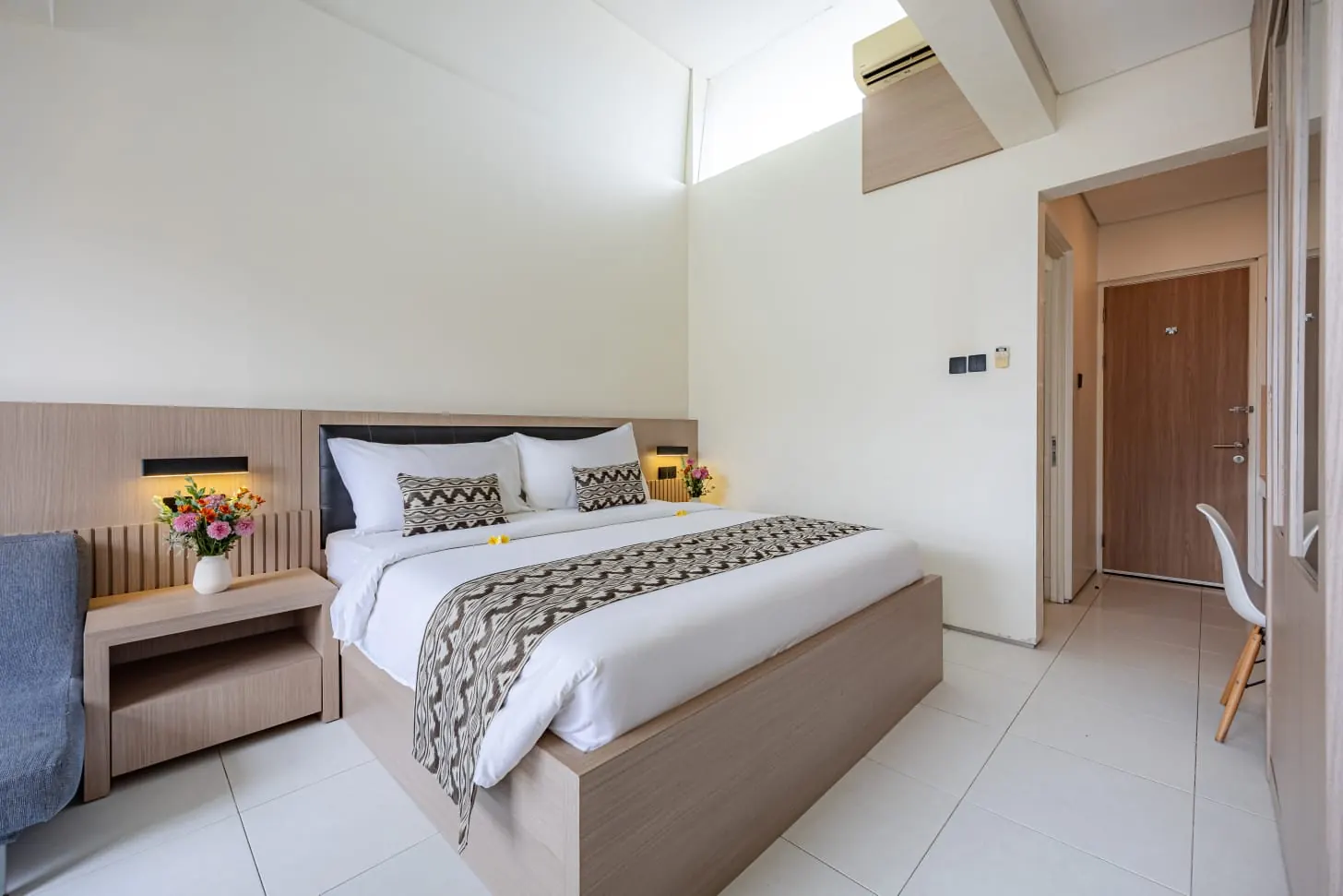 Master Suite bedroom with light wood furnishings and high ceilings