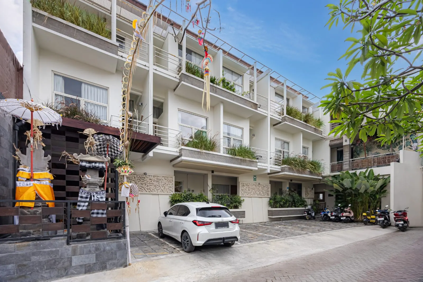 Daytime view of the Bali True Living building and courtyard in Denpasar